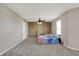 Bedroom with a ceiling fan, window with blinds, and one accent wall at 1330 Redwood Dr, Greenfield, IN 46140