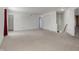 Large bonus room features neutral carpet, white walls, and ample space to customize as a playroom or entertainment zone at 1330 Redwood Dr, Greenfield, IN 46140