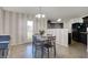 A view of a dining area with a striped wall design and stylish decor provides a cozy eating experience at 1330 Redwood Dr, Greenfield, IN 46140