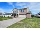 Charming two-story home with brick accents, a covered porch, and a wide driveway at 1330 Redwood Dr, Greenfield, IN 46140