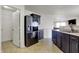 Functional kitchen layout showcases stainless steel appliances, dark cabinetry, and easy access to storage spaces at 1330 Redwood Dr, Greenfield, IN 46140