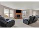 Inviting living room with cozy fireplace, plush seating, and abundant natural light creating a relaxing ambiance at 1330 Redwood Dr, Greenfield, IN 46140