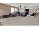 Bright living room featuring plush carpeting, large windows, and comfortable seating at 1330 Redwood Dr, Greenfield, IN 46140