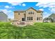 Picture of large backyard featuring green grass, stone steps and paver patio at 13314 Lansbury Ln, Fishers, IN 46037