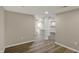 Open basement layout with vinyl flooring and support columns at 13314 Lansbury Ln, Fishers, IN 46037