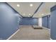 Finished basement space offers recessed lighting and neutral wall color at 13314 Lansbury Ln, Fishers, IN 46037