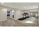 Finished basement features workout area with mirrored wall, a full bathroom, and access to other rooms at 13314 Lansbury Ln, Fishers, IN 46037