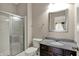 Bathroom with glass shower, granite vanity and sink at 13314 Lansbury Ln, Fishers, IN 46037