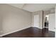 Bedroom featuring large closet, neutral walls, and hardwood floors at 13314 Lansbury Ln, Fishers, IN 46037