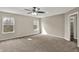 Large bedroom with two windows and a ceiling fan for plenty of natural light and ventilation at 13314 Lansbury Ln, Fishers, IN 46037