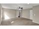 Large bedroom with ceiling fan and neutral carpet, offering a comfortable and inviting atmosphere at 13314 Lansbury Ln, Fishers, IN 46037