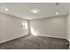 Bright carpeted bedroom with recessed lighting and window at 13314 Lansbury Ln, Fishers, IN 46037
