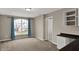 Bedroom featuring an arched window with a view, and desk space to the side at 13314 Lansbury Ln, Fishers, IN 46037