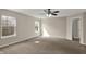The bedroom boasts two windows for natural light and spaciousness with neutral carpet at 13314 Lansbury Ln, Fishers, IN 46037