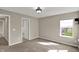 Bedroom featuring a window with an exterior view, neutral walls, and carpet floors at 13314 Lansbury Ln, Fishers, IN 46037