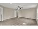 Spacious bedroom with ceiling fan and neutral carpet, offering a comfortable and inviting atmosphere at 13314 Lansbury Ln, Fishers, IN 46037