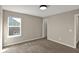 Spacious bedroom with plush carpeting, a large window, and neutral paint throughout at 13314 Lansbury Ln, Fishers, IN 46037
