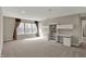 Expansive bonus room featuring abundant built-ins and sunlit windows, perfect for versatile living at 13314 Lansbury Ln, Fishers, IN 46037