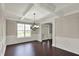 Dining room featuring coffered ceilings, wainscoting, and hardwood floors at 13314 Lansbury Ln, Fishers, IN 46037