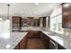 Modern kitchen boasts stainless appliances, granite countertops, and a mosaic tile backsplash at 13314 Lansbury Ln, Fishers, IN 46037
