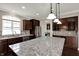 Kitchen with a large island and granite countertops at 13314 Lansbury Ln, Fishers, IN 46037