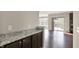 Kitchen view showing granite countertop and access to the outdoor patio at 13314 Lansbury Ln, Fishers, IN 46037