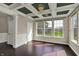Living room featuring hardwood floors and large windows overlooking the yard at 13314 Lansbury Ln, Fishers, IN 46037