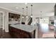 Spacious living room with fireplace, hardwood floors, and staircase at 13314 Lansbury Ln, Fishers, IN 46037