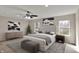 Bright main bedroom with natural light, ceiling fan, and tasteful decorations at 13314 Lansbury Ln, Fishers, IN 46037