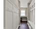 Bright mudroom with coat hooks, wainscoting, bench, and cubbies; perfect for organization at 13314 Lansbury Ln, Fishers, IN 46037