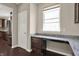 Office nook with granite countertops, storage and window at 13314 Lansbury Ln, Fishers, IN 46037