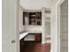 Convenient desk space with granite countertops and storage shelves at 13314 Lansbury Ln, Fishers, IN 46037