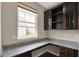 Office space with granite countertops and storage shelves at 13314 Lansbury Ln, Fishers, IN 46037