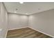 Finished room with vinyl flooring, recessed lighting, and neutral paint at 13314 Lansbury Ln, Fishers, IN 46037