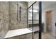 Modern shower featuring a glass door, a built-in bench, and contemporary tile work at 13314 Lansbury Ln, Fishers, IN 46037