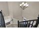 Staircase displaying the foyer and chandelier that illuminate this home at 13314 Lansbury Ln, Fishers, IN 46037