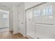 Bathroom with tiled shower with glass doors, and a window at 13418 Vickery Ridge Dr, Fishers, IN 46037
