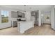 Bright kitchen featuring an island, gray cabinets, and stainless steel appliances at 13418 Vickery Ridge Dr, Fishers, IN 46037