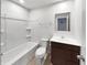 Bright bathroom featuring tile floors, a shower-tub, and a modern vanity at 13813 N Hawkers Hill Dr, Camby, IN 46113