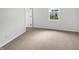 Simple bedroom features soft carpeting, natural light and neutral walls at 13813 N Hawkers Hill Dr, Camby, IN 46113