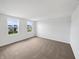 Neutral bedroom with natural light streaming through large windows and carpeted flooring at 13813 N Hawkers Hill Dr, Camby, IN 46113