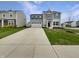 Charming two-story home with gray siding, double garage, blue shutters and a well-manicured lawn at 13813 N Hawkers Hill Dr, Camby, IN 46113
