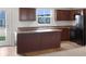 Functional kitchen with rich cabinetry, island, modern appliances, and natural light at 13813 N Hawkers Hill Dr, Camby, IN 46113