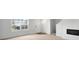 Bright living room featuring a decorative fireplace, sleek furniture, and a carpeted floor at 13813 N Hawkers Hill Dr, Camby, IN 46113