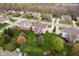 Wide aerial shot of a home with lush landscaping and a spacious backyard, nestled in a friendly neighborhood at 13933 Wildcat Dr, Carmel, IN 46033