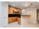 Bar area with wood cabinetry and black countertop at 13933 Wildcat Dr, Carmel, IN 46033