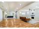 Spacious basement with hardwood floors, a projector screen and a fireplace at 13933 Wildcat Dr, Carmel, IN 46033