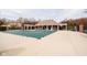 Large community pool area with lounge chairs and covered seating space, perfect for relaxation and socializing at 13933 Wildcat Dr, Carmel, IN 46033