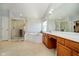 Spacious main bathroom featuring a shower stall, soaking tub, double vanity sink, and ample storage at 13933 Wildcat Dr, Carmel, IN 46033