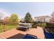 An outdoor deck features a table, chairs, and bench seating providing a relaxing space for outdoor gatherings at 13933 Wildcat Dr, Carmel, IN 46033